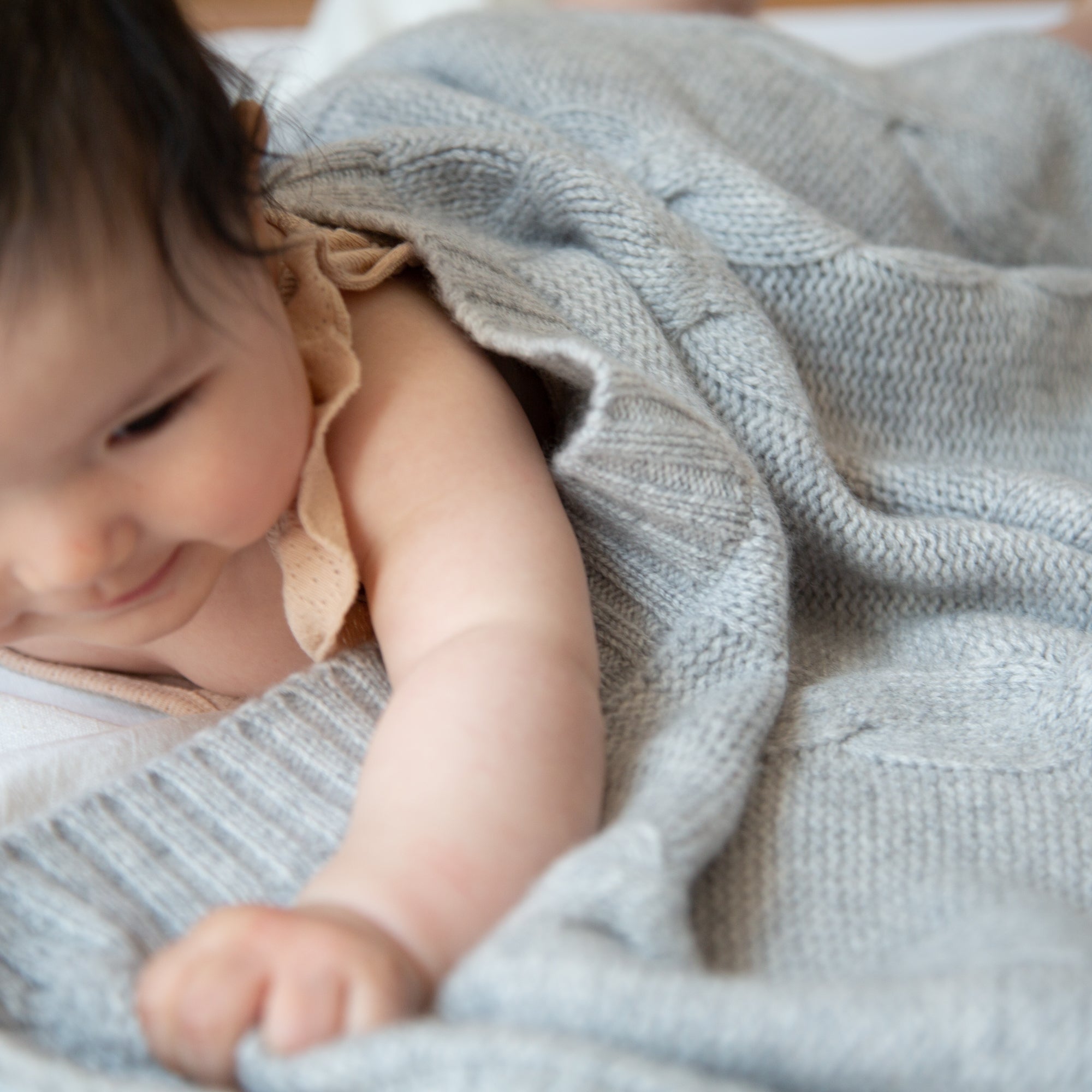 JULES cashmere baby blanket with cable-knit pattern