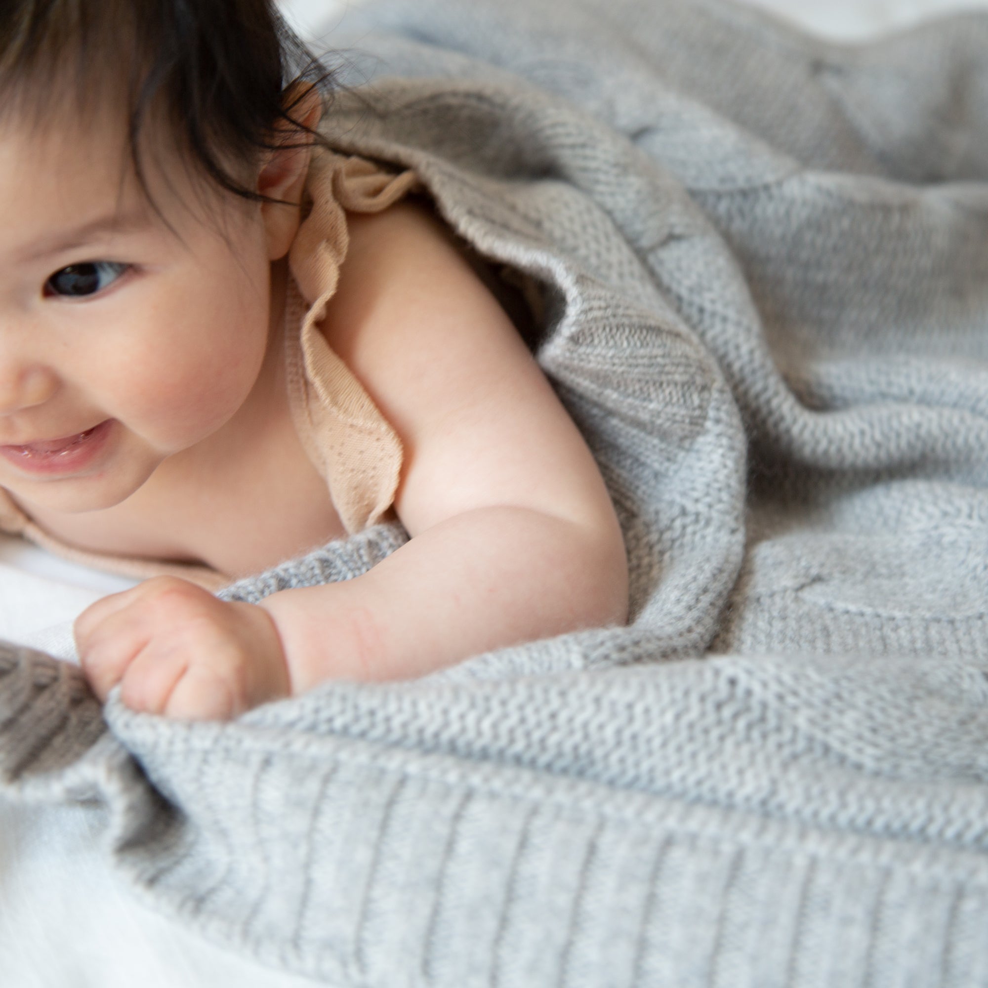 JULES cashmere baby blanket with cable-knit pattern