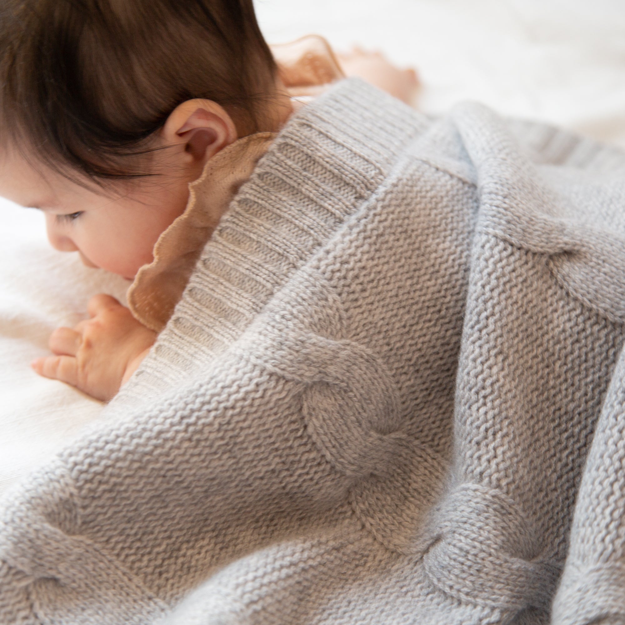 JULES cashmere baby blanket with cable-knit pattern